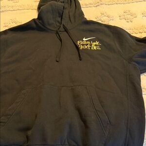 Nike Black Hoodie with Vibrant Yellow Text